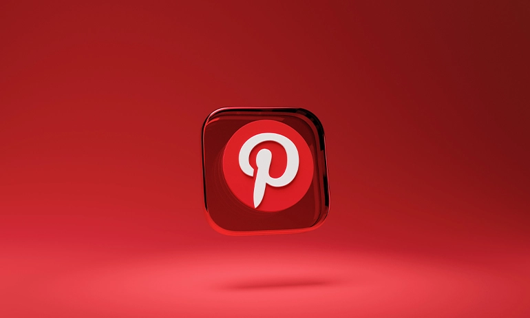 3D illustration of the Pinterest logo on a shiny, reflective red surface.