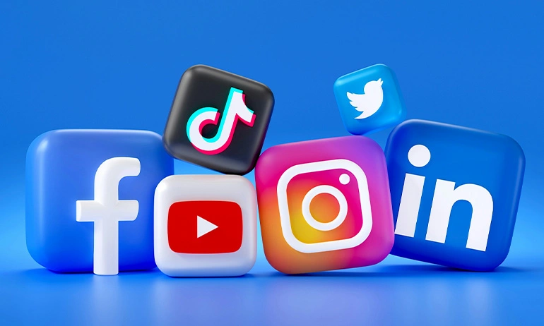 Assorted social media platform icons (Facebook, YouTube, Instagram, TikTok, Twitter, LinkedIn) as 3D cubes on a blue background.