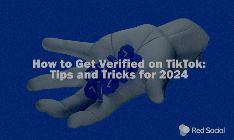 a hand holding verified badges with text in the middle saying "How to Get Verified on TikTok: Tips and Tricks for 2024"